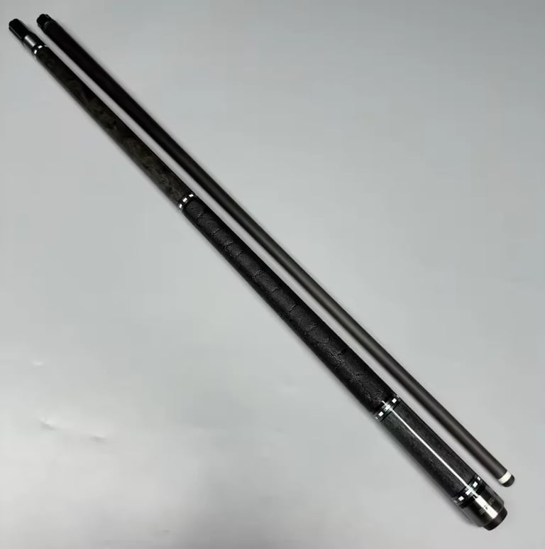 Black billiard pool cue with wrapped grip and chrome ferrules on light gray background